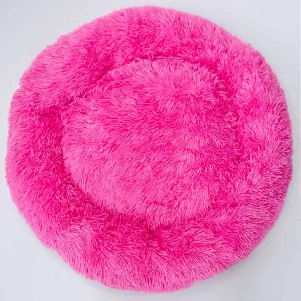 Das runde Hundebett „Pink Pouf Supersoft“ ist super gemütlich und bringt Farbe in Deine vier Wände.