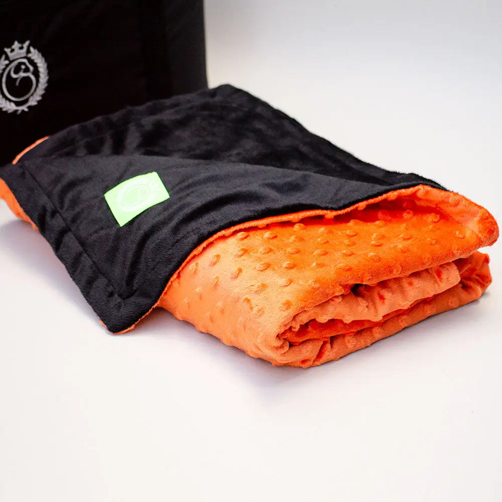 Die weiche und kuschelige Wendedecke  "2 Sides" orange-schwarz 4legs.de